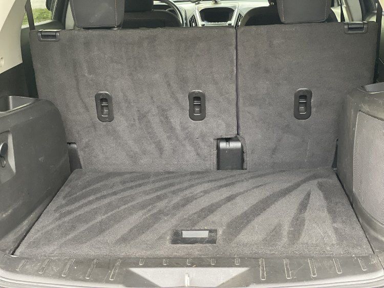 Clean and detailed interior of an Equinox, showcasing pristine upholstery and spacious cargo area, emphasizing On Demand Detailing's mobile service quality and vehicle care.